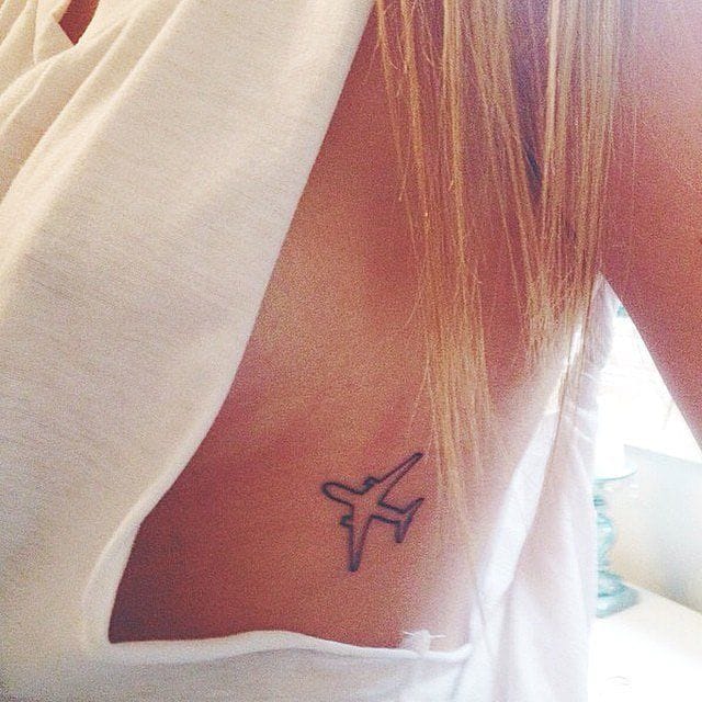Meanings of Small Tattoo Ideas and Where to Get Them 13 small airplane tattoo near the chest