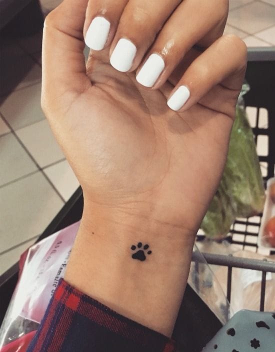 Meanings of Small Tattoo Ideas and Where to Get Them 12 small dog paw tattoo on ankle