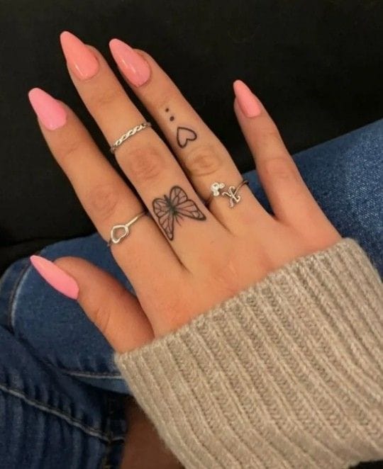 Meanings of Small Tattoo Ideas and Where to Get Them 5 small butterfly and a heart tattooed on his hand