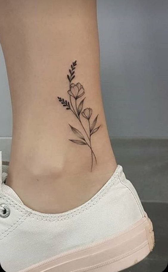 Meanings of Small Tattoo Ideas and Where to Get Them 7 small flower tattoo ankle