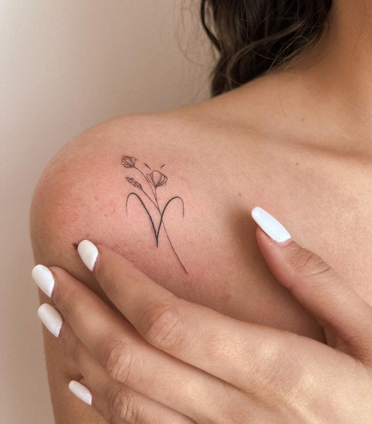 Meanings of Small Tattoo Ideas and Where to Get Them 21 small minimalist flower tattoo on the shoulder