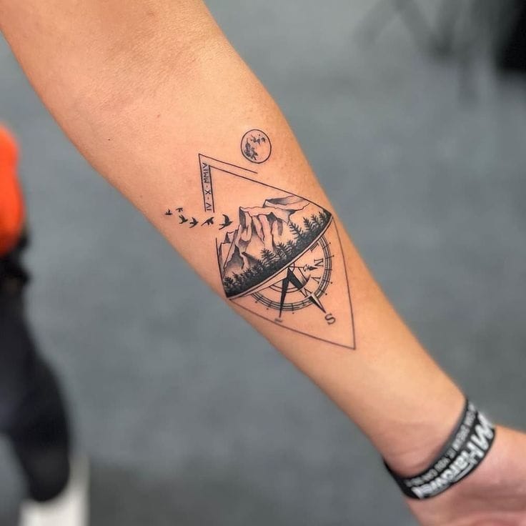 Geometric Mountain and Compass Tattoo A Minimalist Adventure Design
