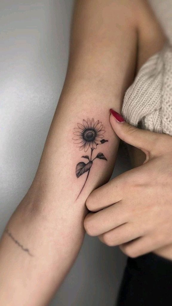 Sunflower Tattoo Meaning, Designs & Placement Ideas 3 Small black and gray sunflower tattoo on the inner arm