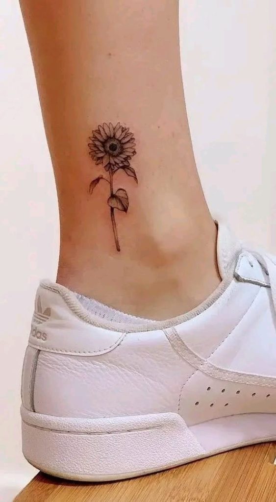 Sunflower Tattoo Meaning, Designs & Placement Ideas 4 Delicate fine-line sunflower tattoo near the ankle